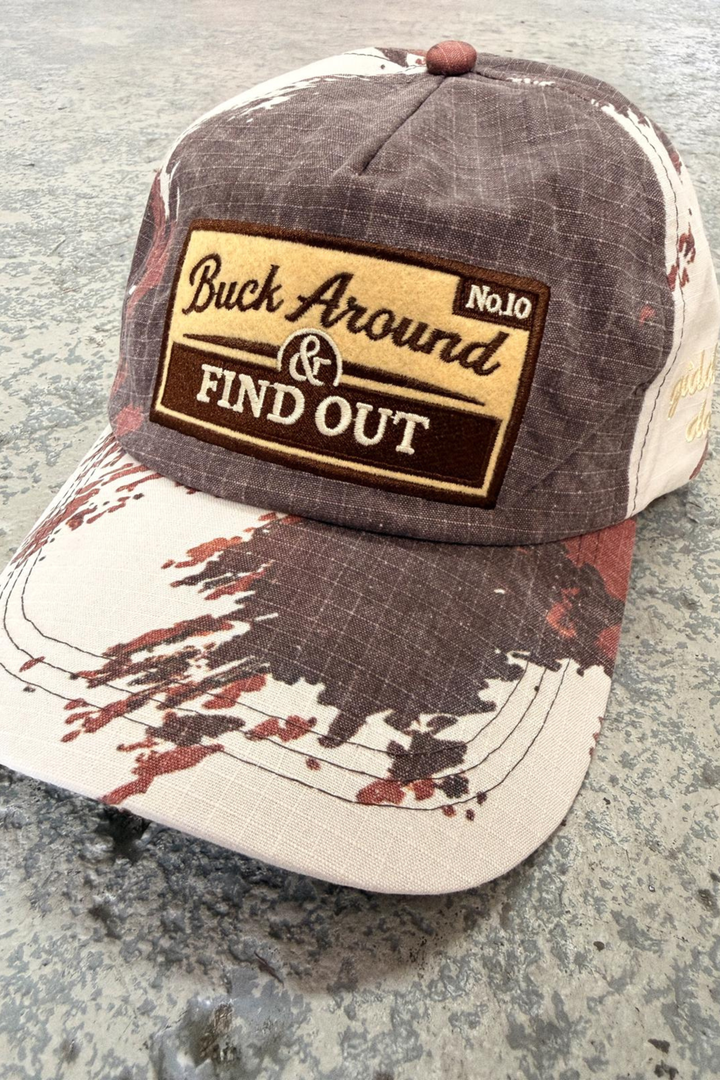 THE BUCK AROUND COW CAP