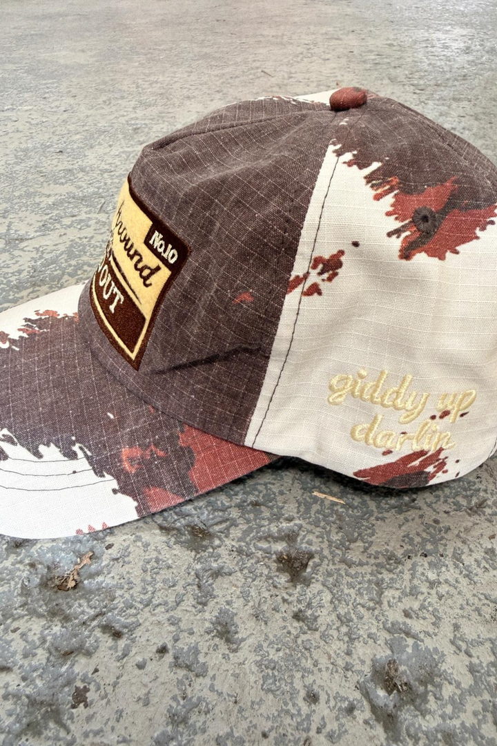 THE BUCK AROUND COW CAP