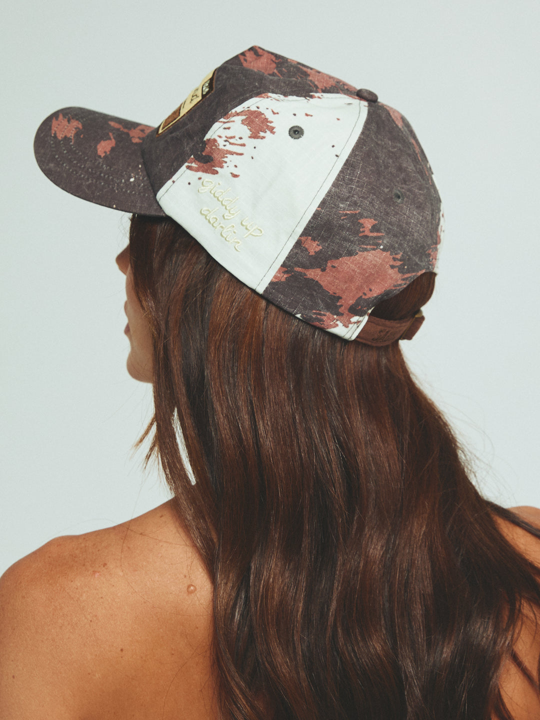THE BUCK AROUND COW CAP
