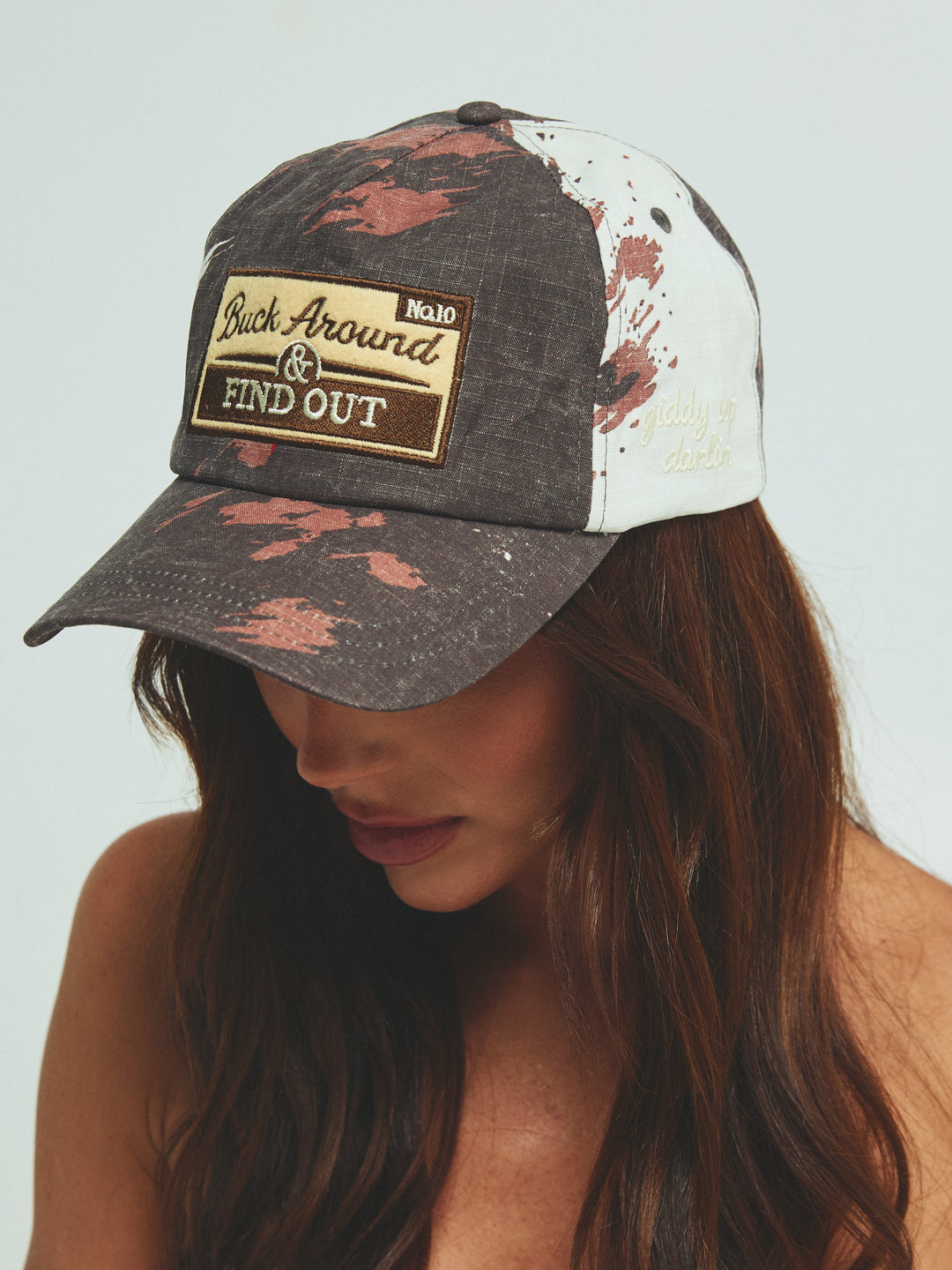 THE BUCK AROUND COW CAP