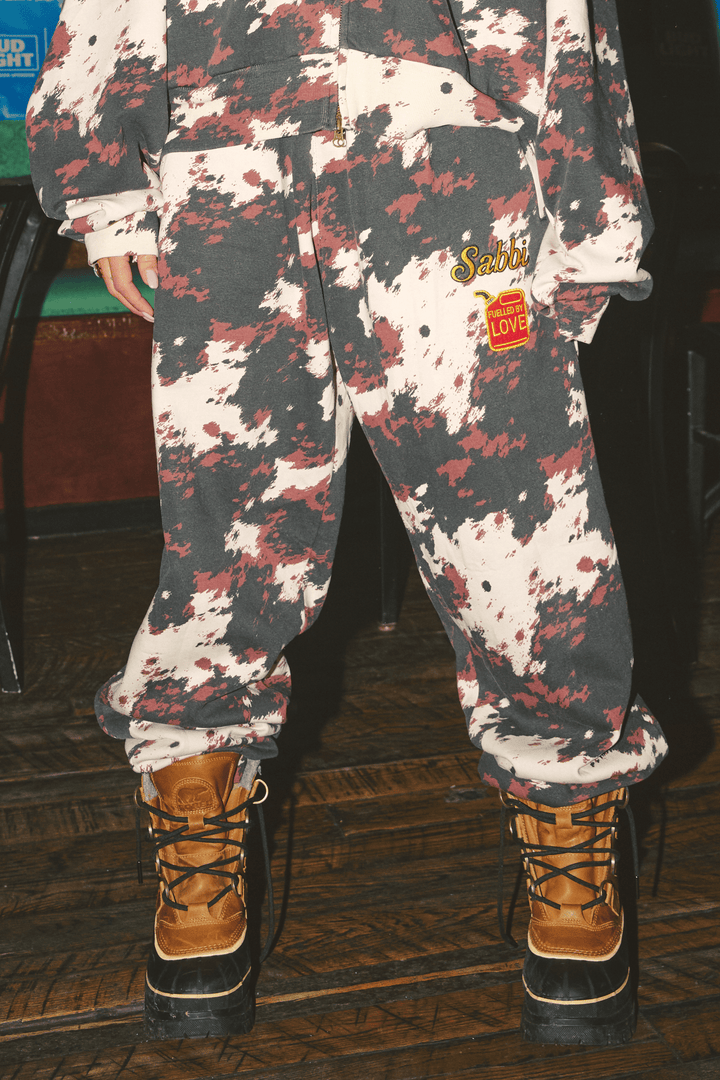 THE COW PRINT CUFFED SWEAT PANTS